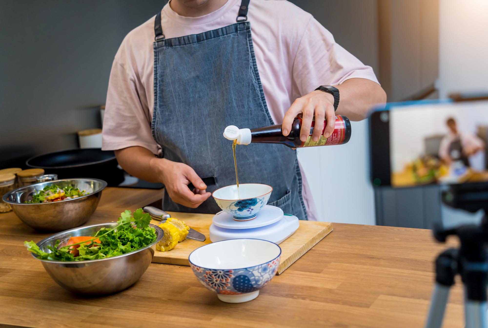 Instructor tasting and adjusting seasoning